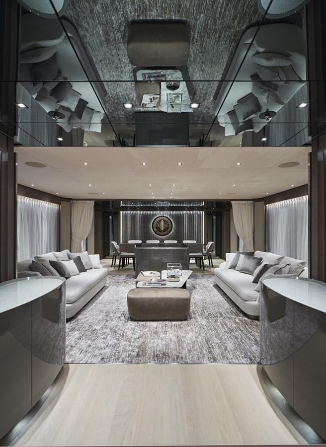 a large living room with a fireplace aboard SP1 Yacht for Sale