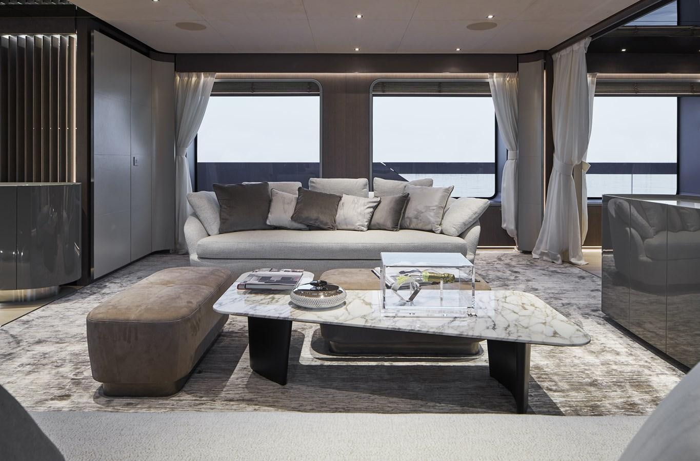 a living room with a couch and a coffee table aboard SP1 Yacht for Sale