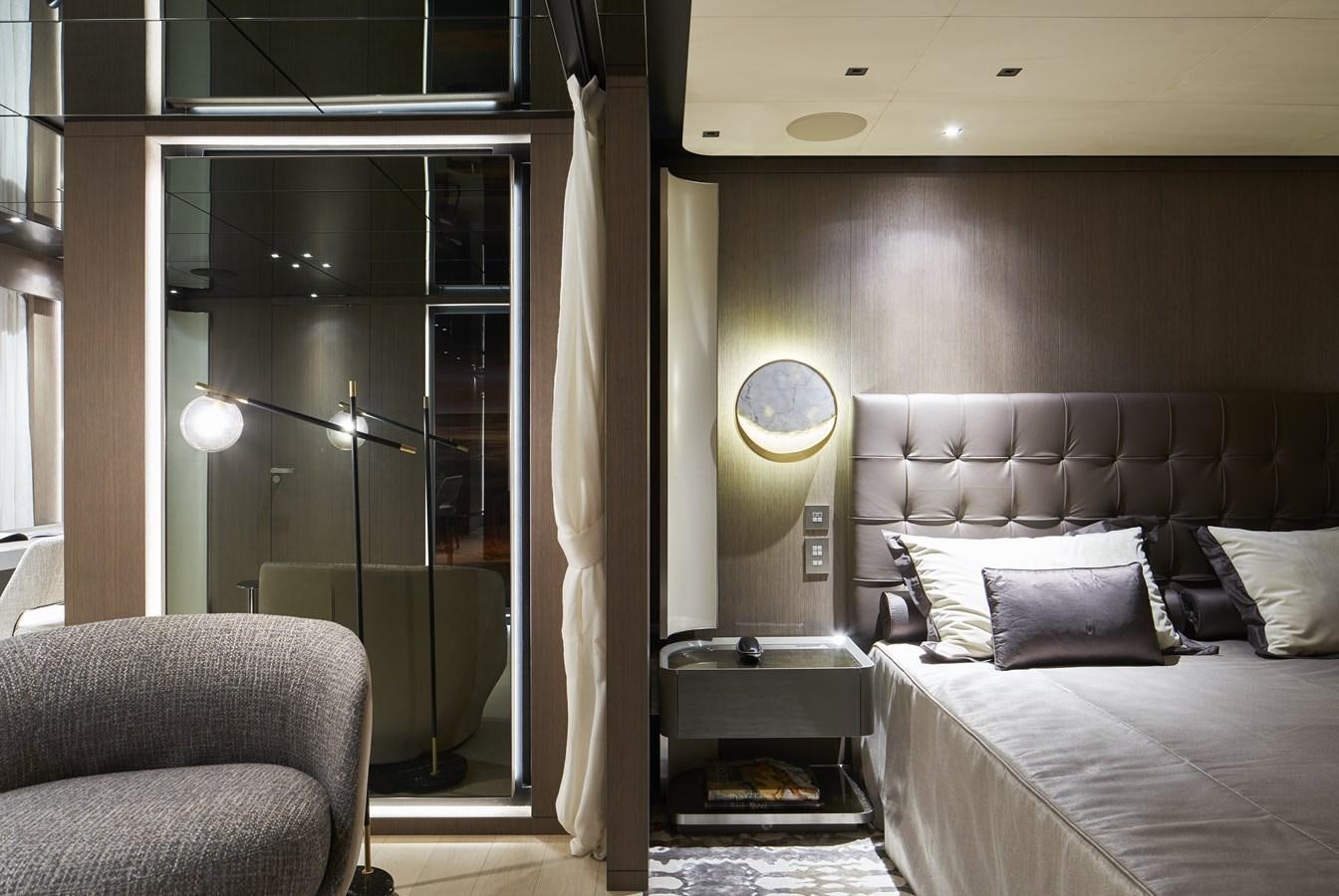 a room with a bed and a chair aboard SP1 Yacht for Sale