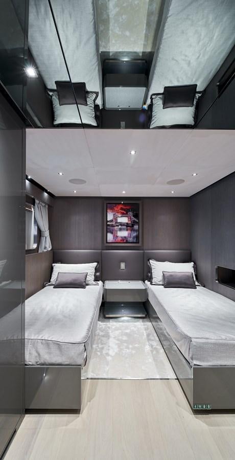 a room with a bed and a chair aboard SP1 Yacht for Sale