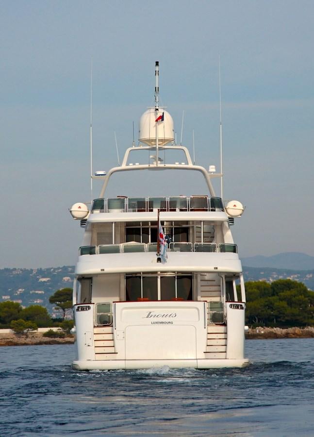 a white boat on the water aboard INOUIS Yacht for Sale