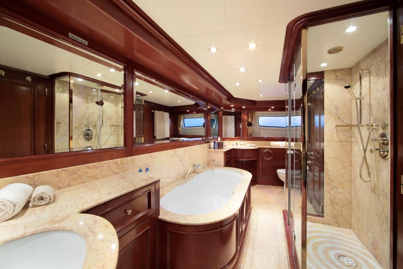 a bathroom with a large mirror aboard INOUIS Yacht for Sale