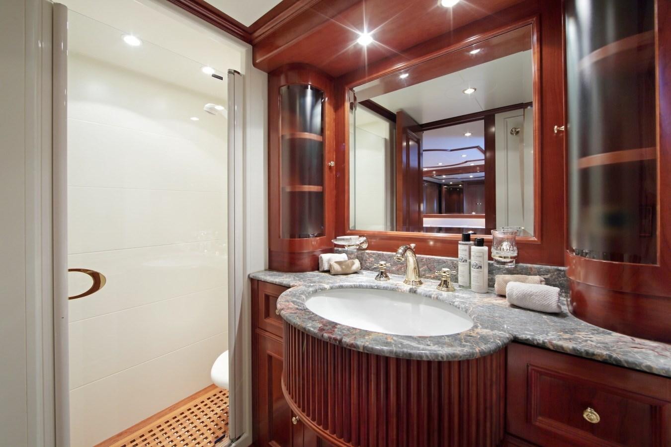 a bathroom with a large mirror aboard INOUIS Yacht for Sale