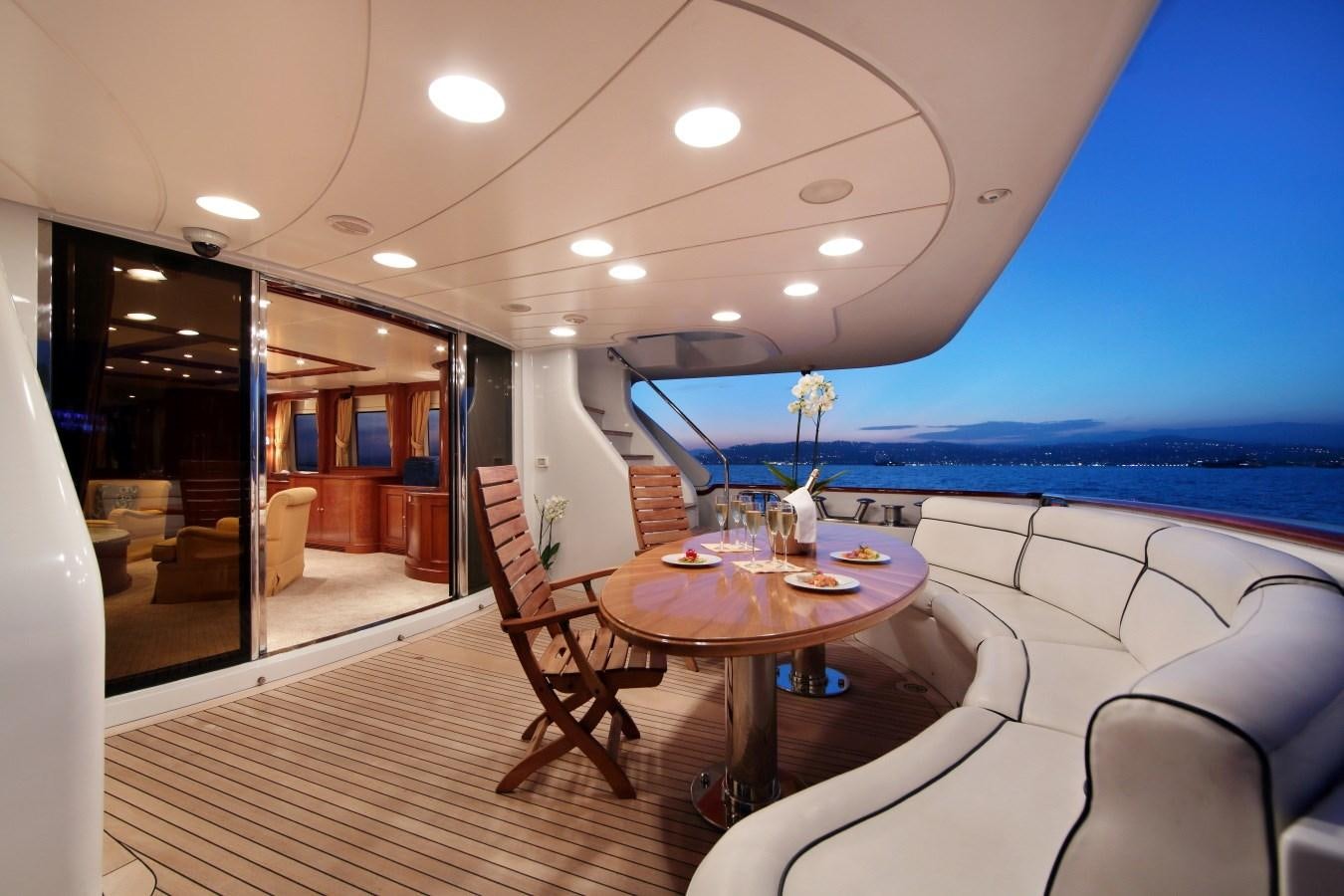a room with a table and chairs aboard INOUIS Yacht for Sale