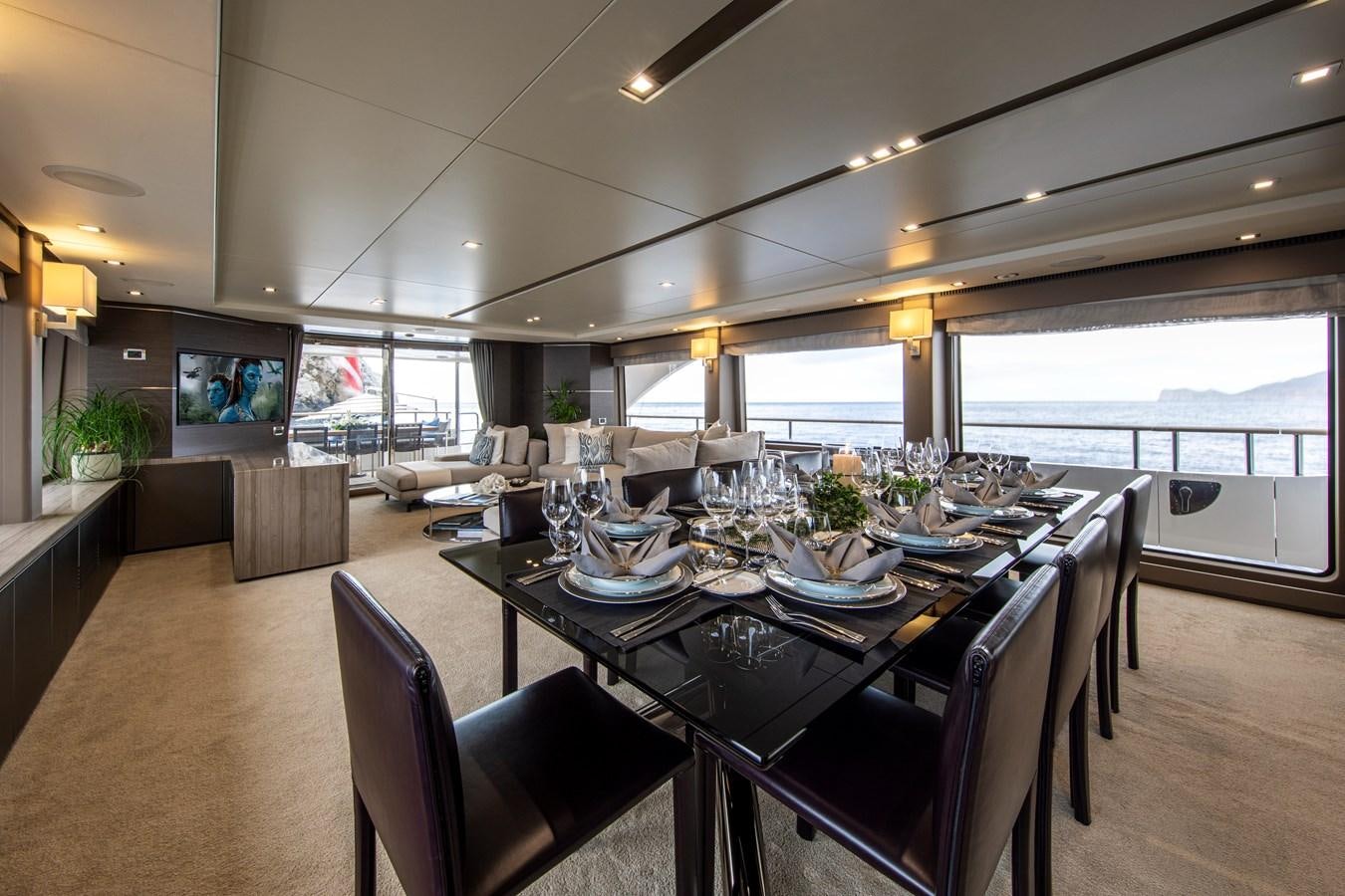 a dining room with a table and chairs aboard ORSO 3 Yacht for Sale