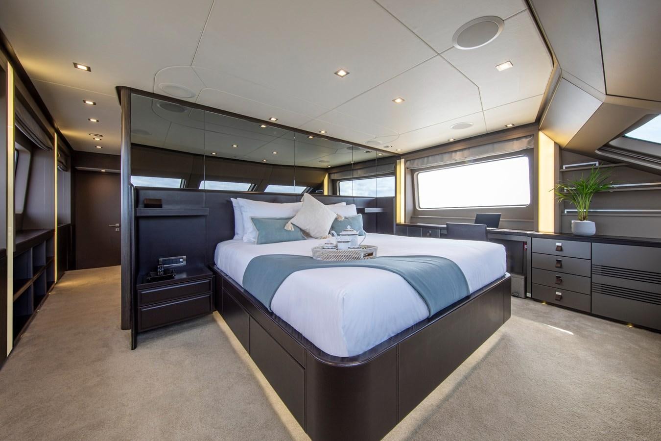 a bedroom with a large bed aboard ORSO 3 Yacht for Sale