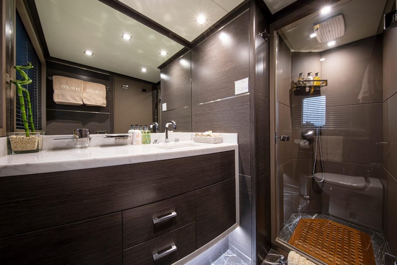 a bathroom with a large mirror aboard ORSO 3 Yacht for Sale