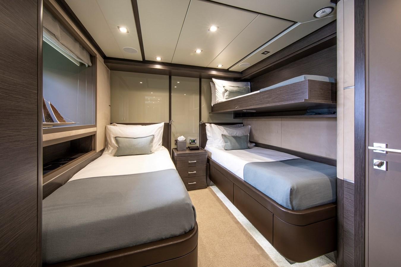 a room with a couple beds aboard ORSO 3 Yacht for Sale