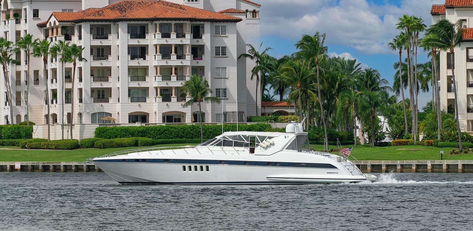 a white boat in the water aboard HAKUNA MATATA Yacht for Sale