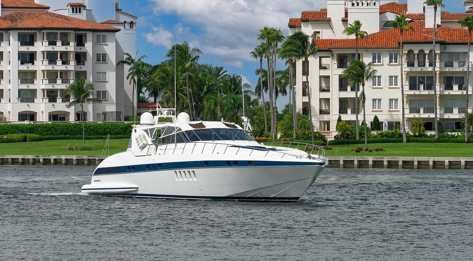 a white boat on water aboard HAKUNA MATATA Yacht for Sale