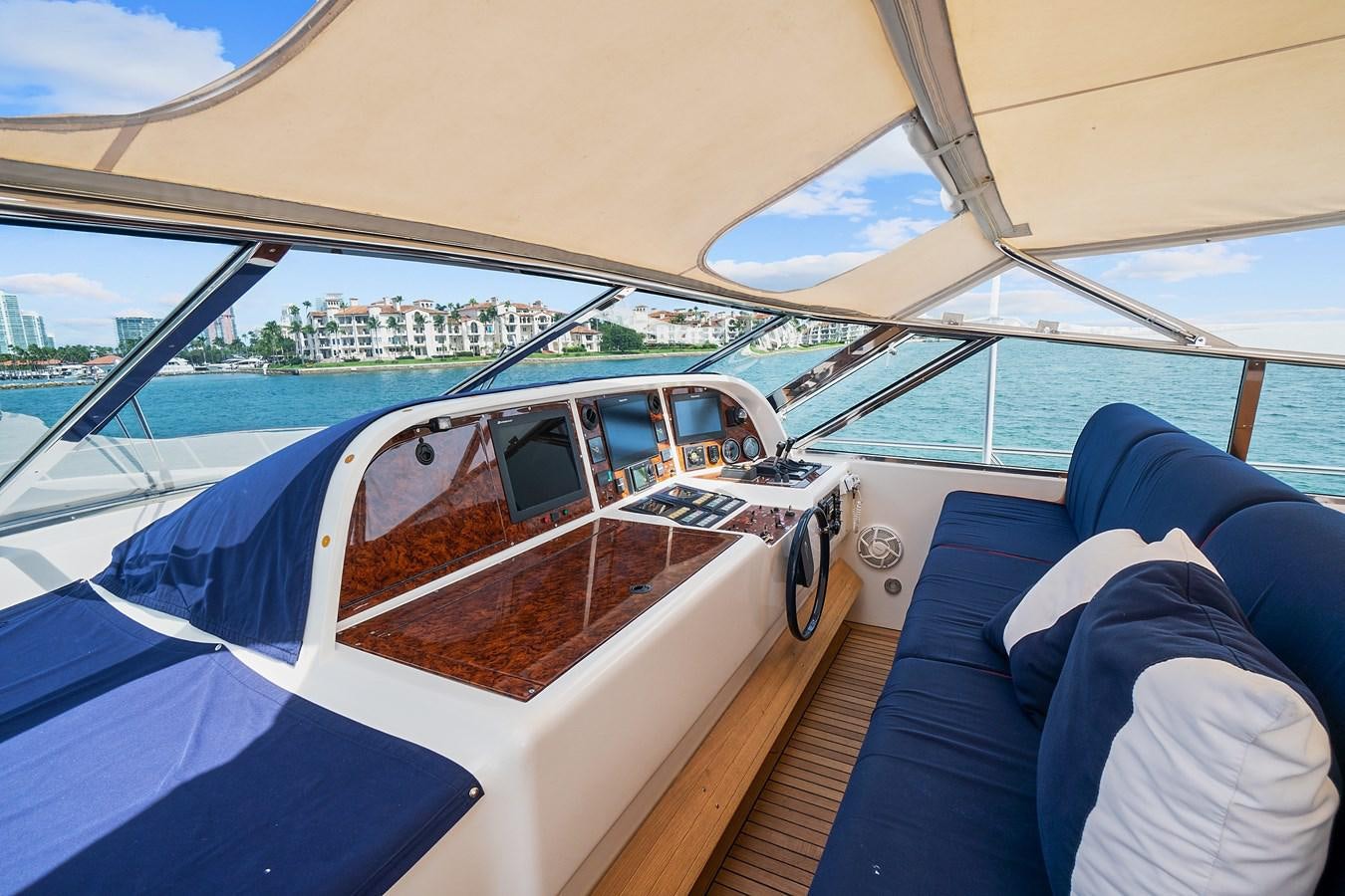 a boat with a view of the water and the land below aboard HAKUNA MATATA Yacht for Sale