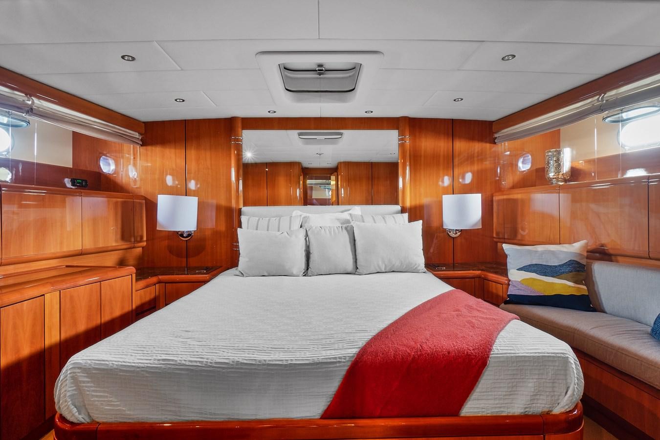 a room with a bed and a couch aboard HAKUNA MATATA Yacht for Sale