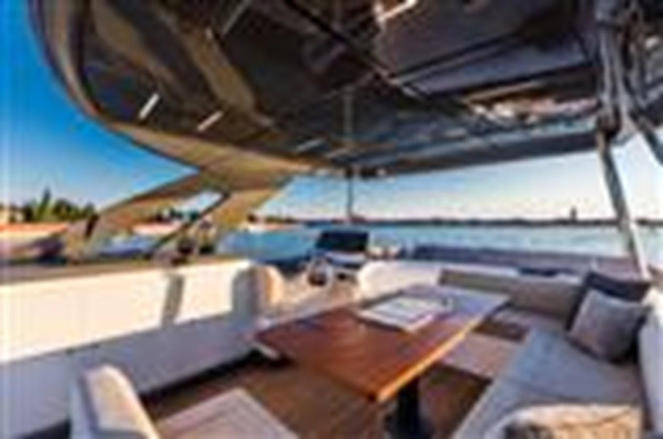 a room with a pool and a deck aboard FERRETTI YACHTS 670  Yacht for Sale