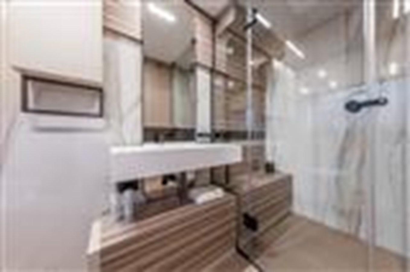 a bathroom with a sink and a mirror aboard FERRETTI YACHTS 670  Yacht for Sale