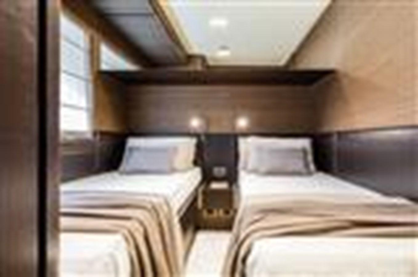a room with two beds aboard FERRETTI YACHTS 670  Yacht for Sale