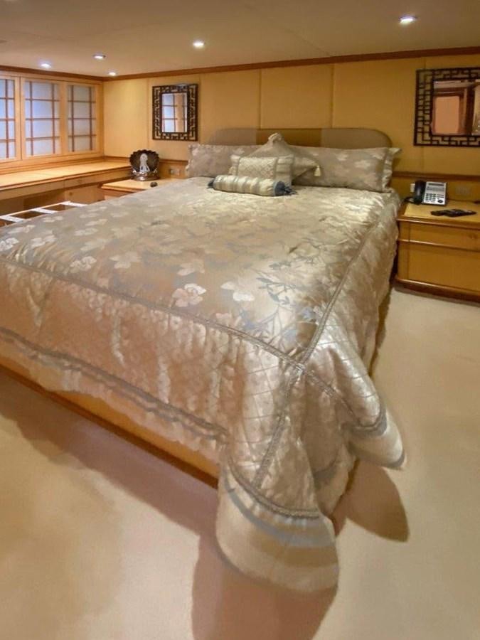 a bed with a blanket aboard LADY HAYAT Yacht for Sale