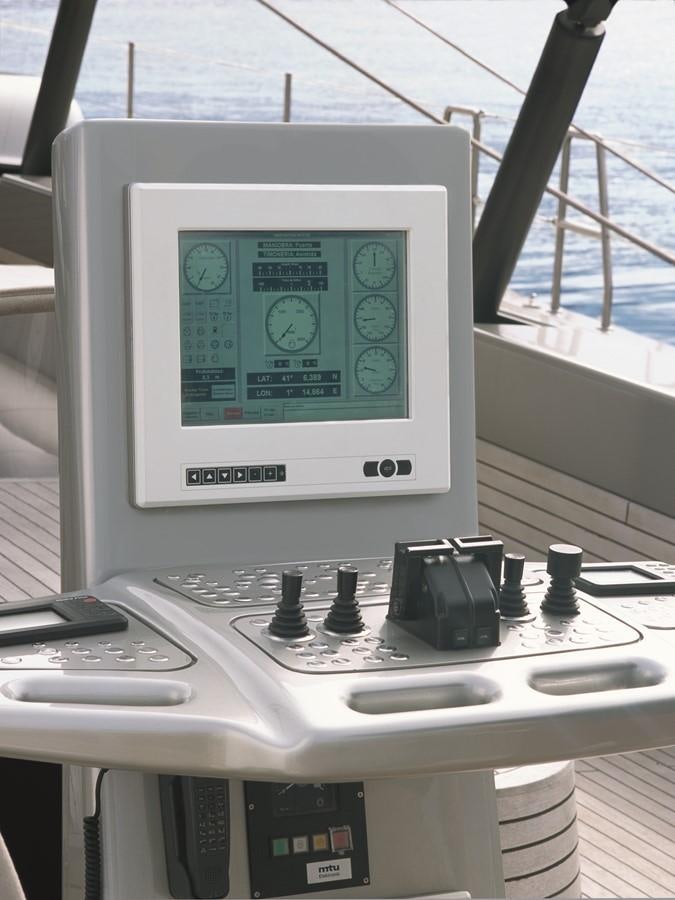 a computer on a table aboard SYL Yacht for Sale