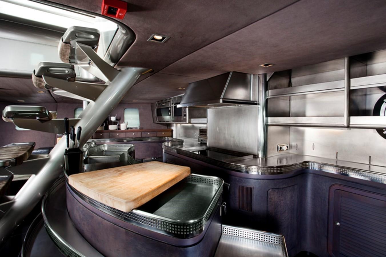 a large kitchen with stainless steel appliances aboard SYL Yacht for Sale