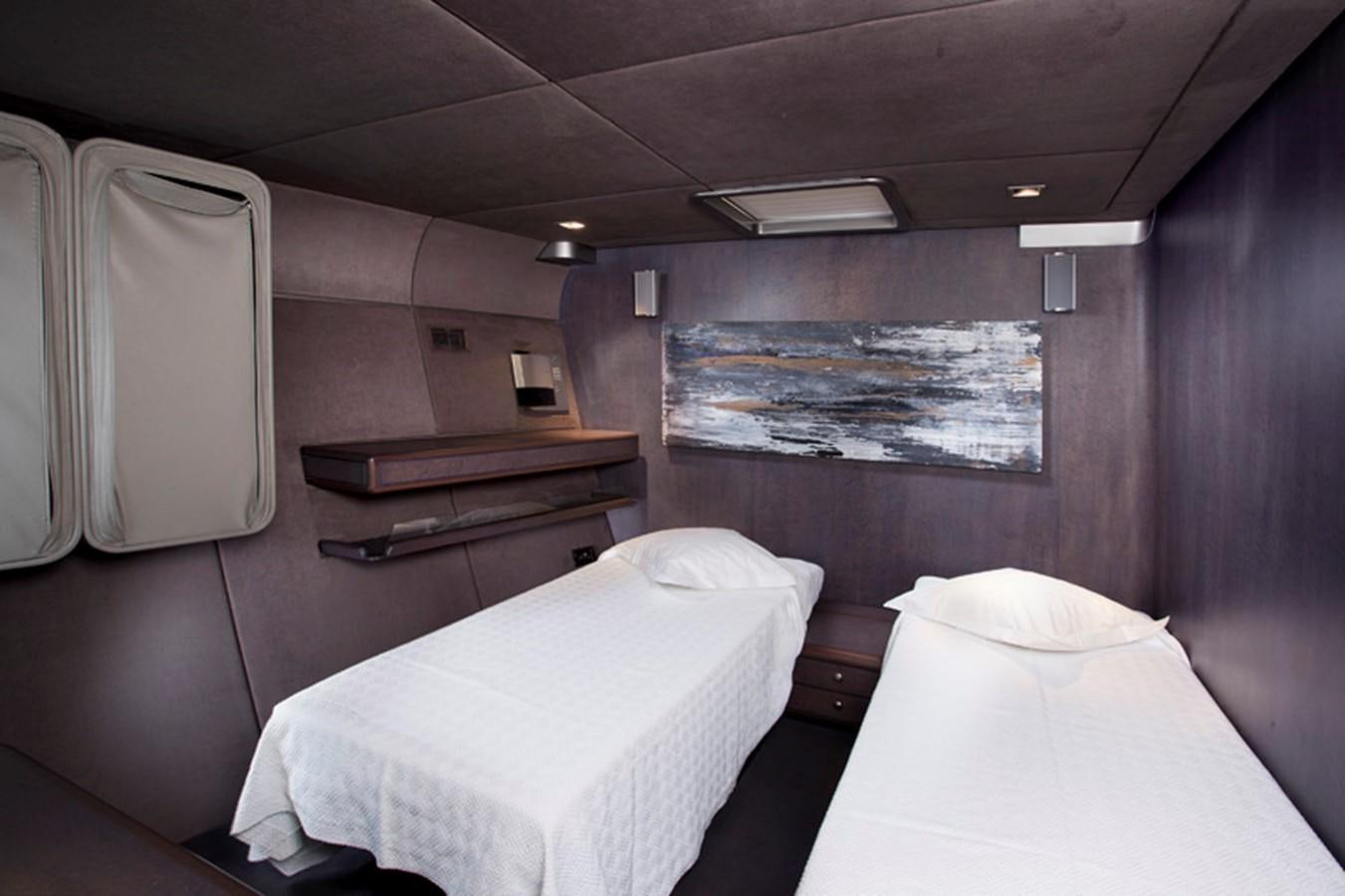 a couple of beds in a room aboard SYL Yacht for Sale