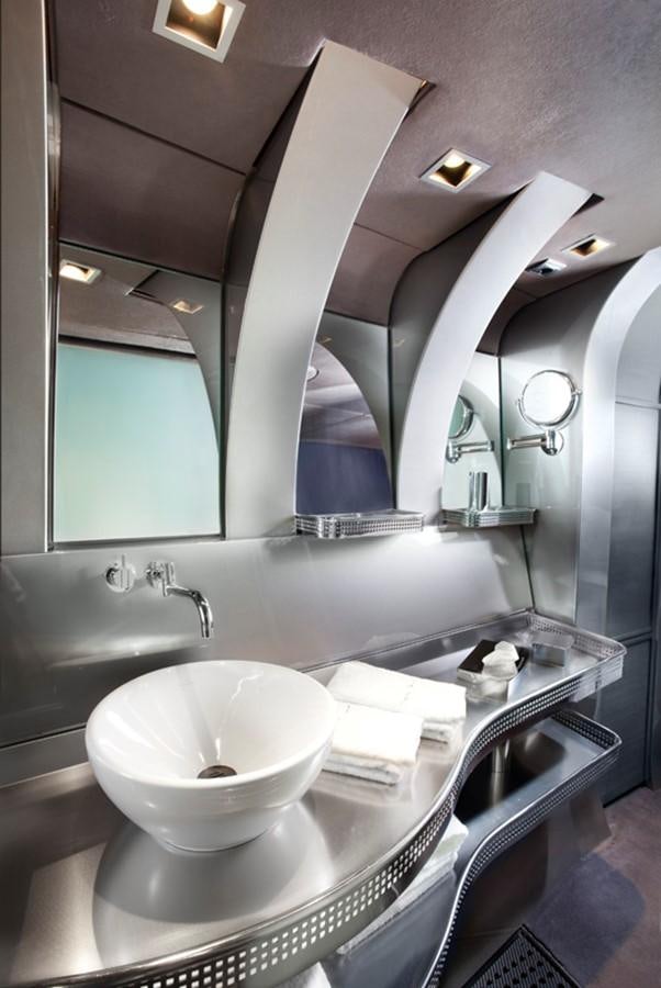 a bathroom with a large mirror aboard SYL Yacht for Sale
