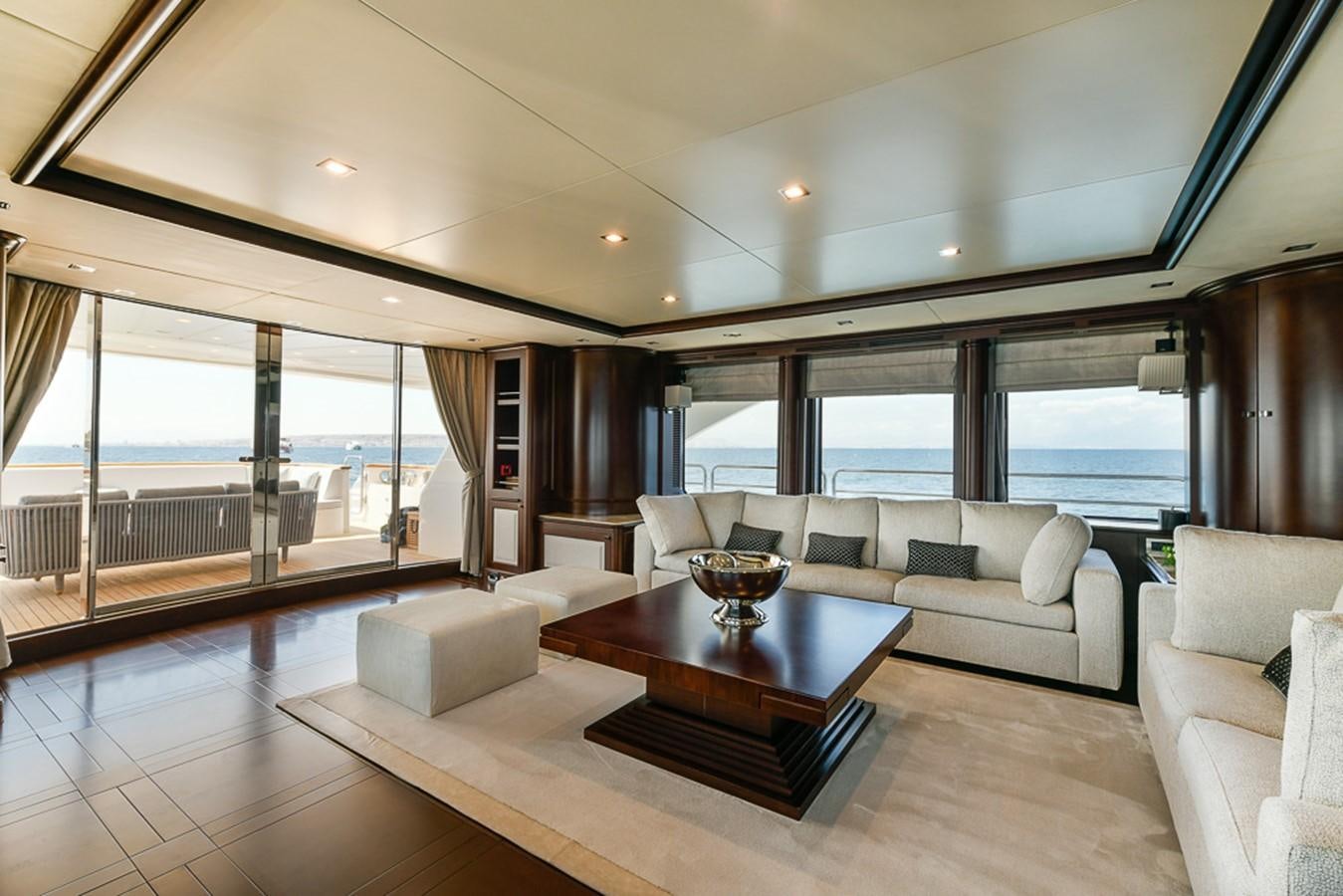 a living room with a large window aboard ELENA NUEVE Yacht for Charter