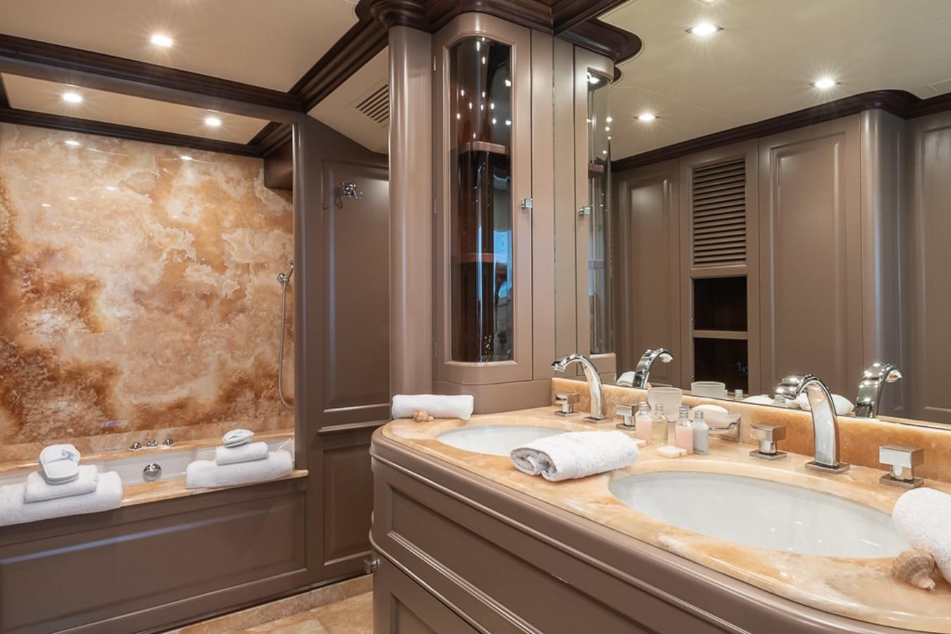 a bathroom with a large mirror aboard ELENA NUEVE Yacht for Charter