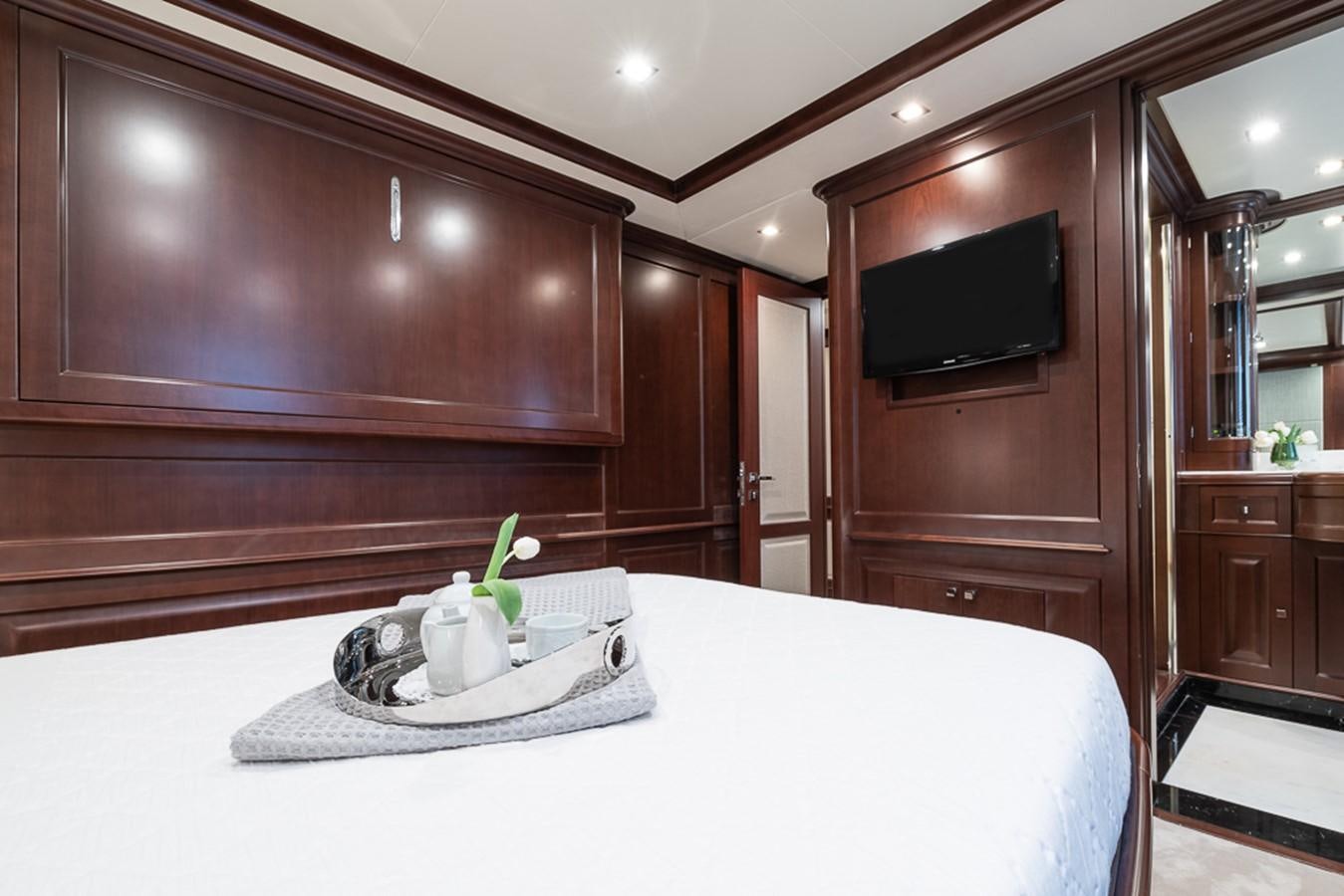 a white table with a plant on it aboard ELENA NUEVE Yacht for Charter