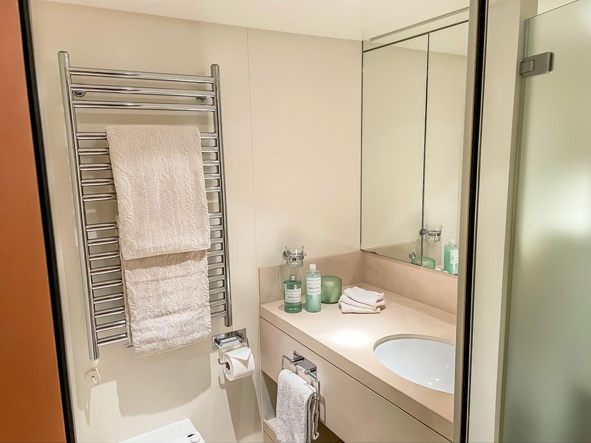 a bathroom with a towel rack aboard AMMOUN OF LONDON Yacht for Sale