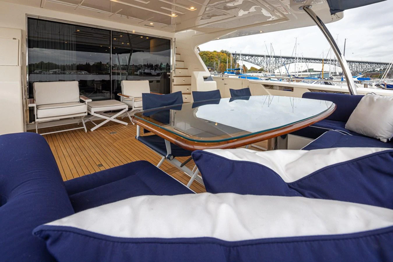 a room with a bed and a blue couch aboard SOL SHINE Yacht for Sale