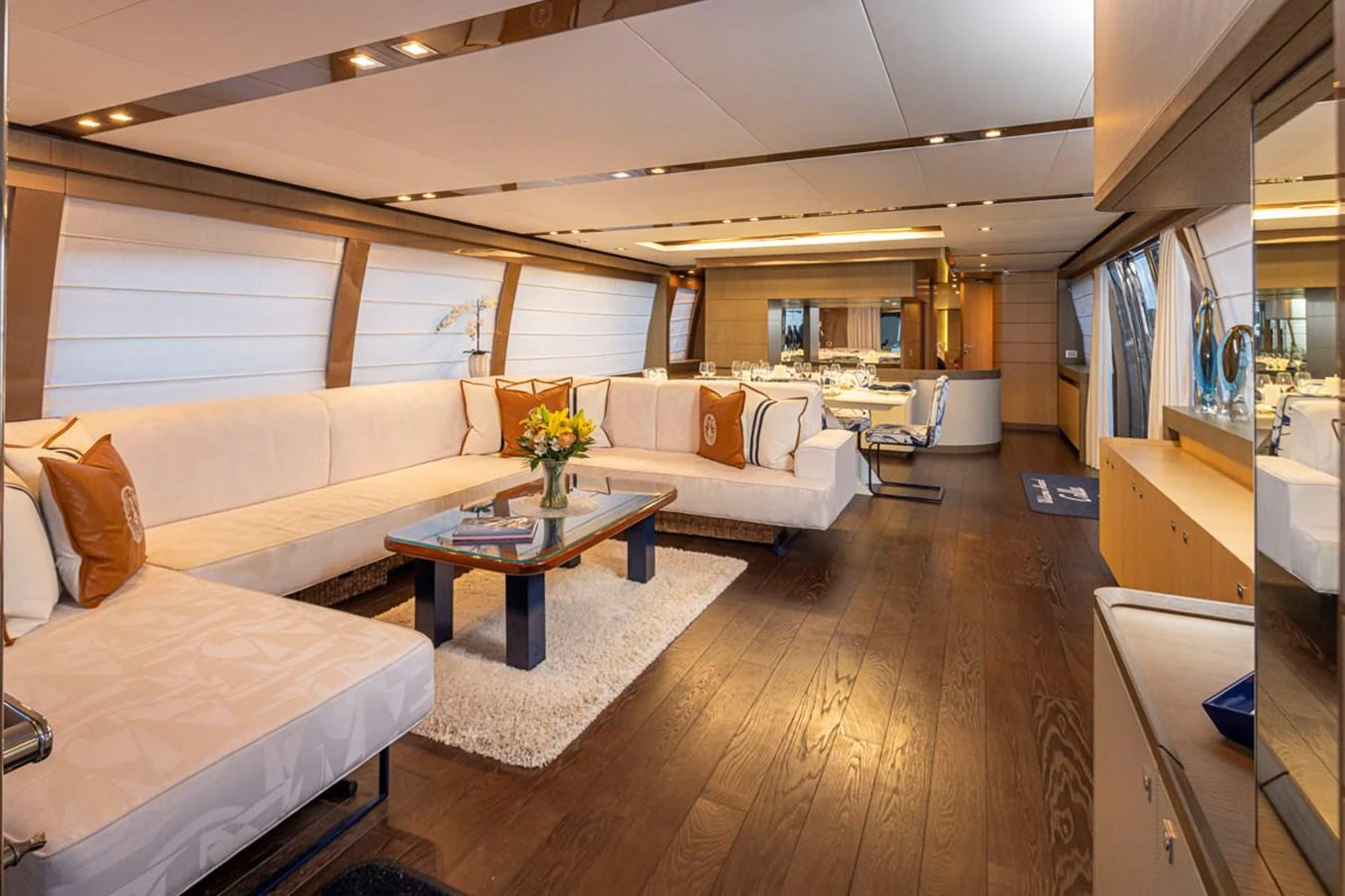 a living room with a couch and a coffee table aboard SOL SHINE Yacht for Sale