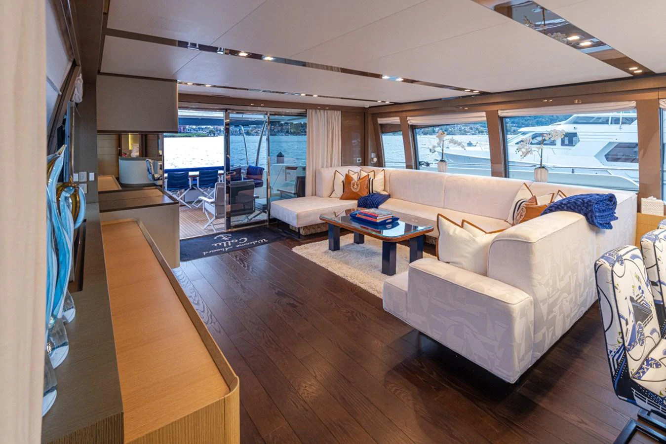 a living room with a large window aboard SOL SHINE Yacht for Sale