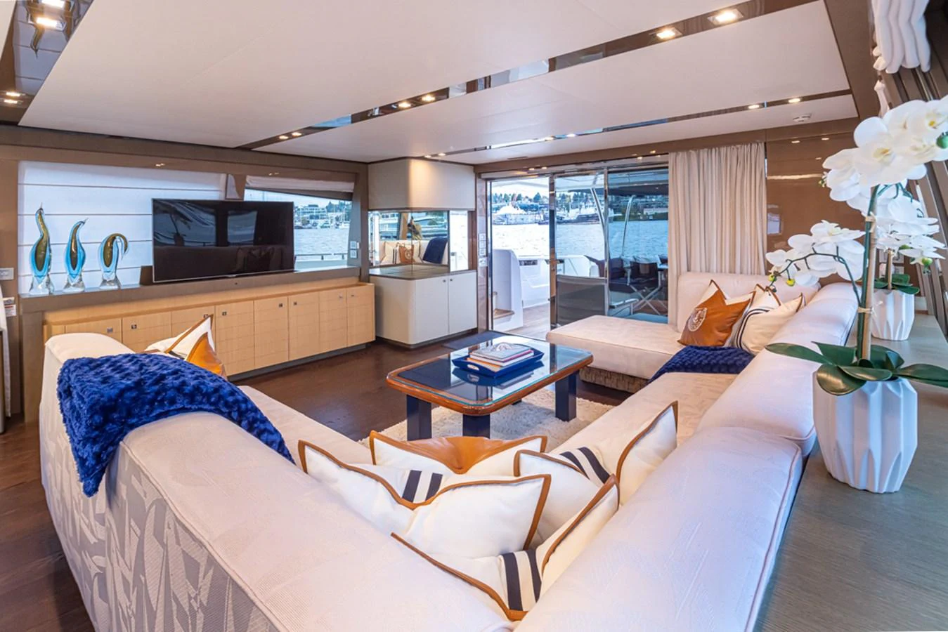 a living room with a large window aboard SOL SHINE Yacht for Sale