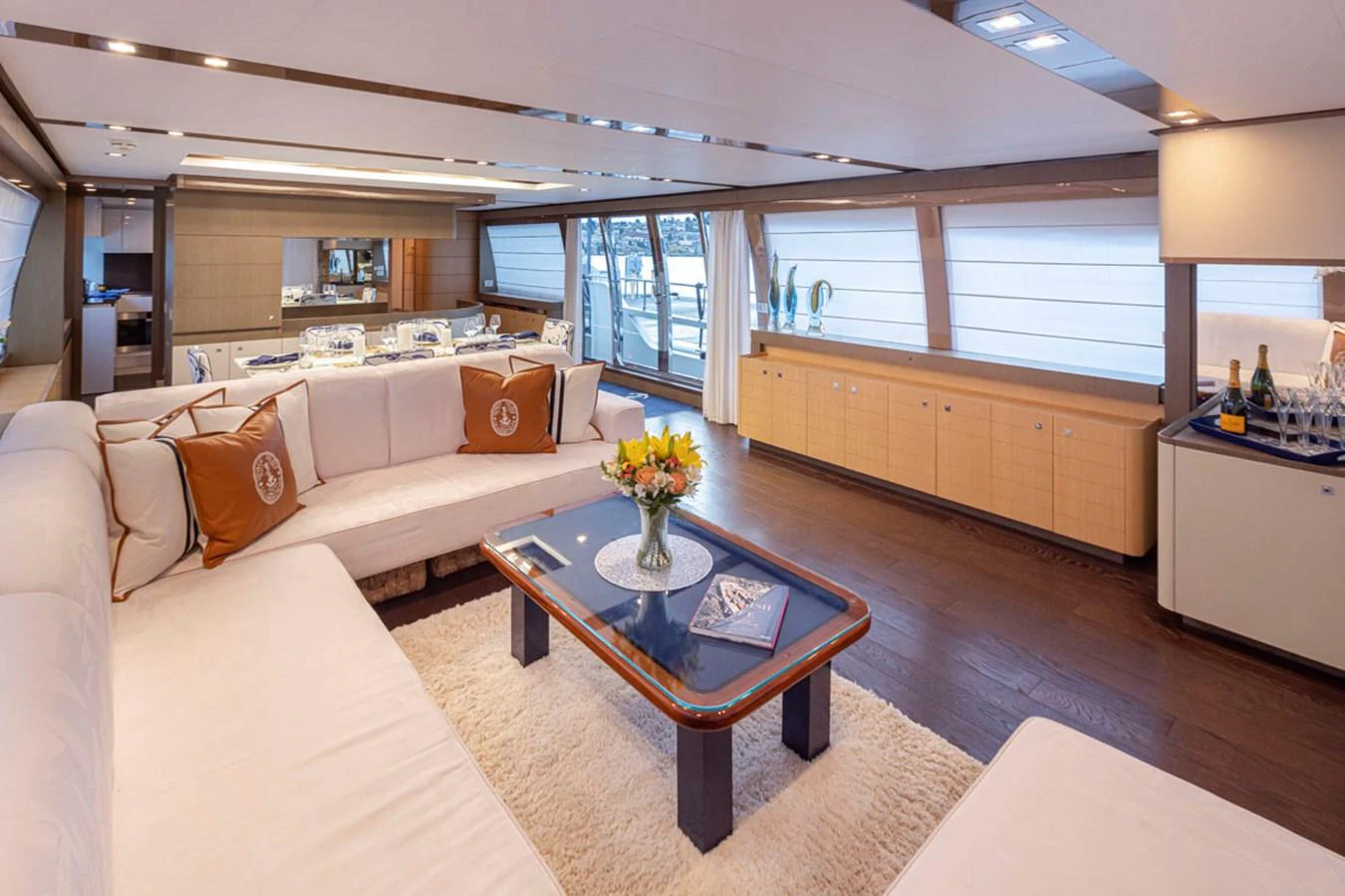 a living room with a couch and a coffee table aboard SOL SHINE Yacht for Sale