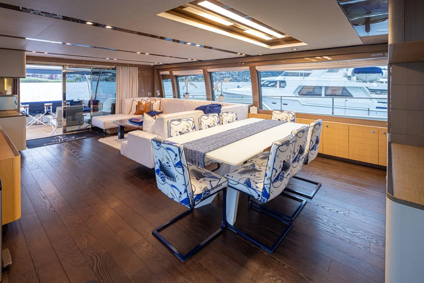 a room with a couch and a table and chairs aboard SOL SHINE Yacht for Sale