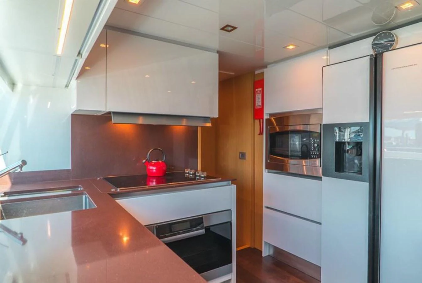 a kitchen with a stainless steel stove aboard SOL SHINE Yacht for Sale