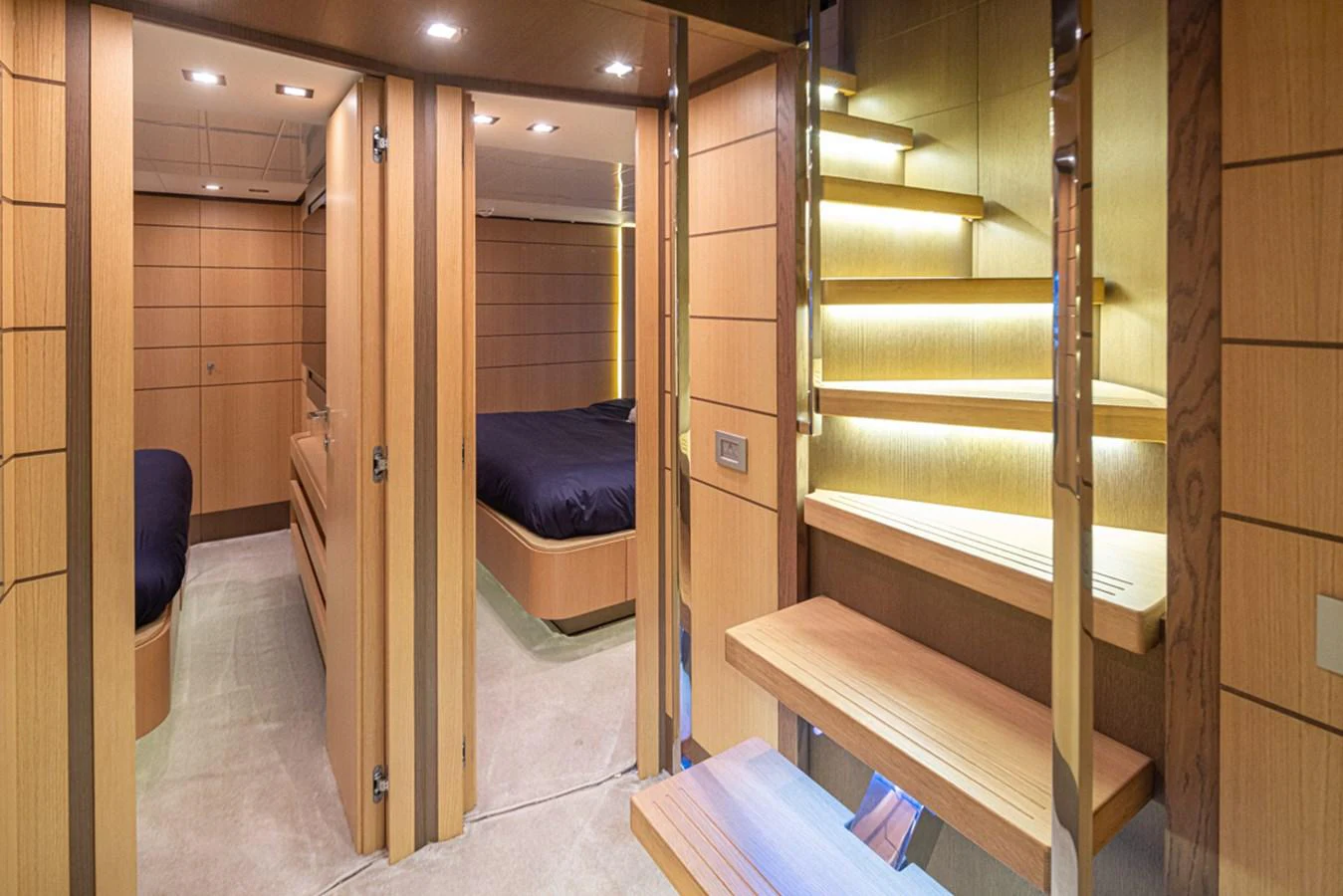 a room with wooden bunk beds aboard SOL SHINE Yacht for Sale