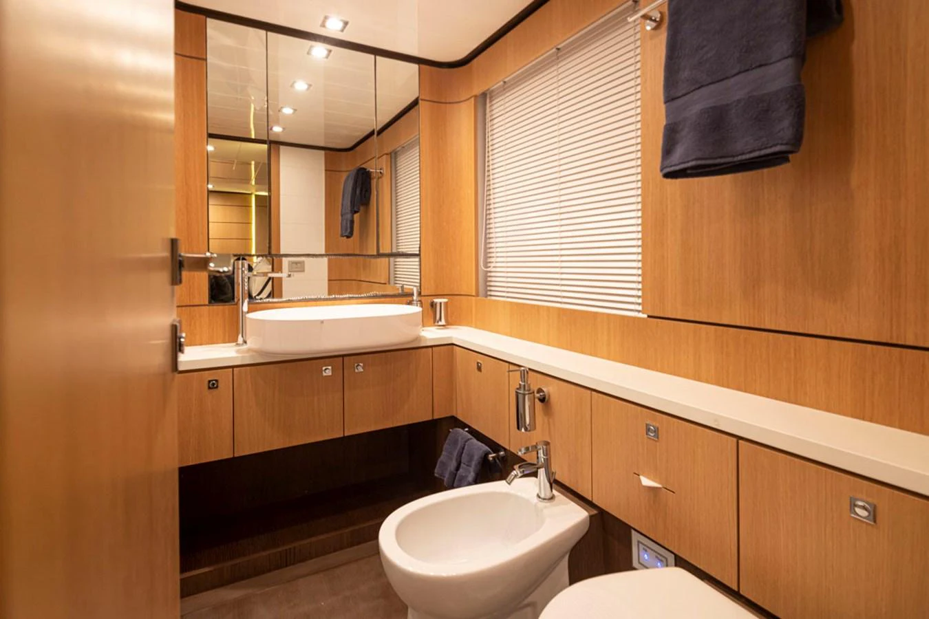 a bathroom with a sink and a mirror aboard SOL SHINE Yacht for Sale