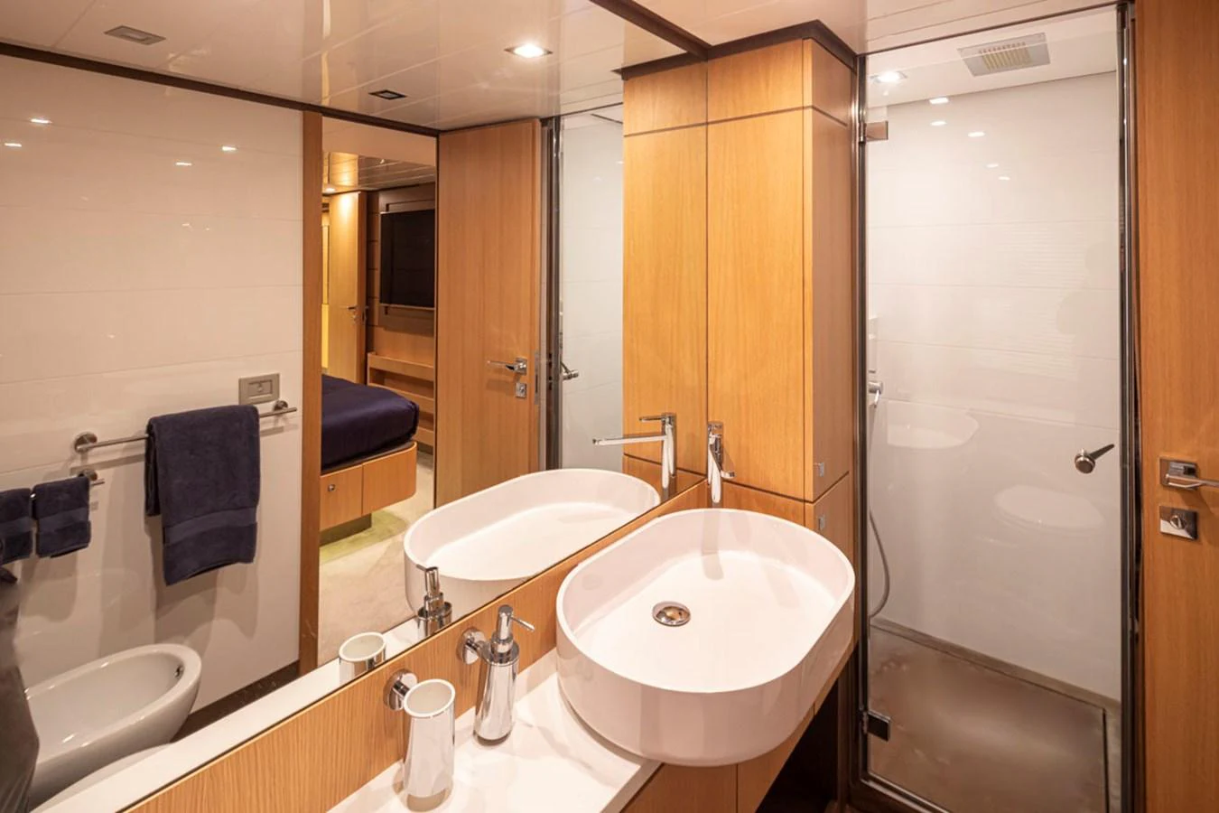 a bathroom with a large mirror aboard SOL SHINE Yacht for Sale