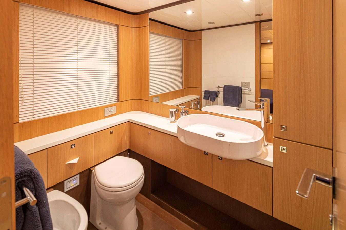 a bathroom with a toilet and sink aboard SOL SHINE Yacht for Sale