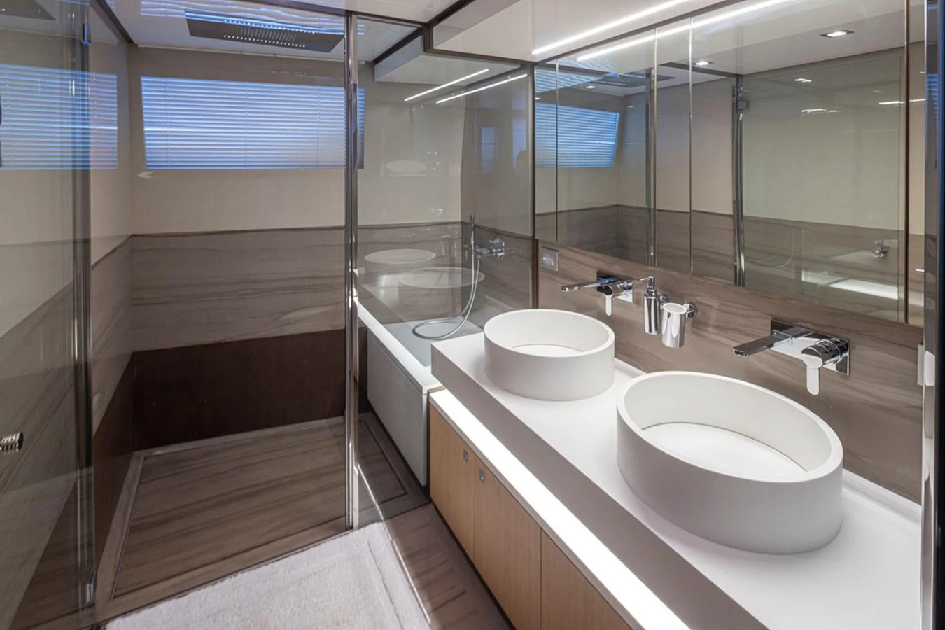 a bathroom with a sink and a mirror aboard SOL SHINE Yacht for Sale