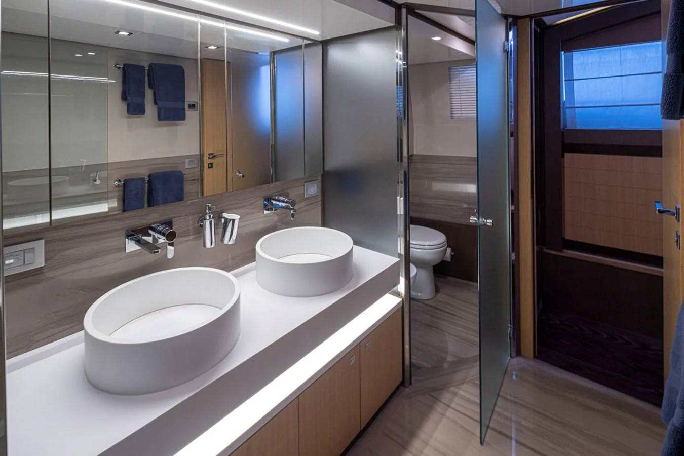 a bathroom with sinks and mirrors aboard SOL SHINE Yacht for Sale