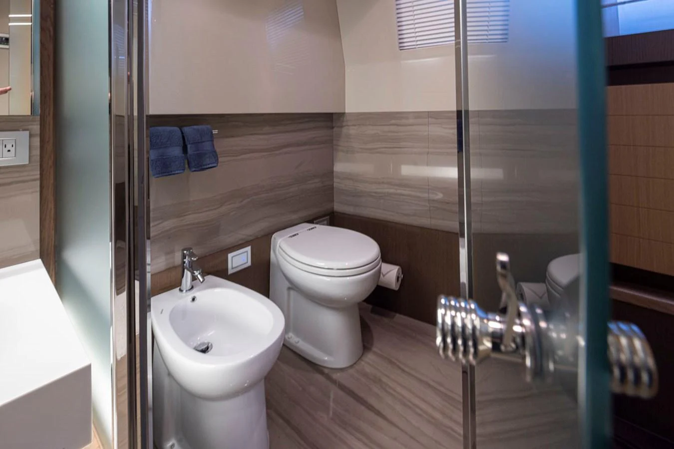 a bathroom with a toilet and sink aboard SOL SHINE Yacht for Sale