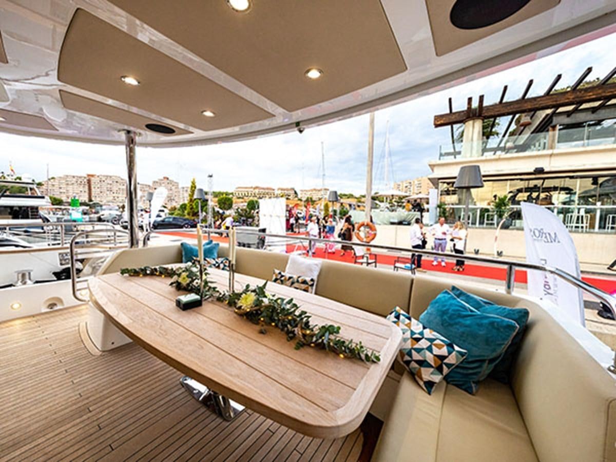 a large room with a couch and a table with plants on it aboard 28M Yacht for Sale
