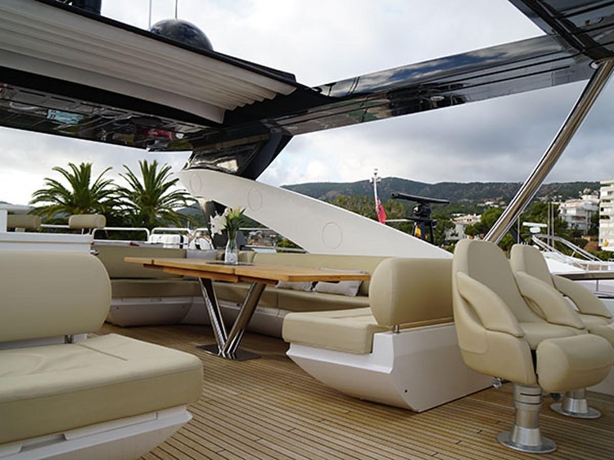 a room with a table and chairs aboard 28M Yacht for Sale