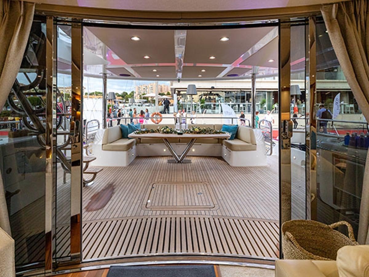 a room with a table and chairs aboard 28M Yacht for Sale