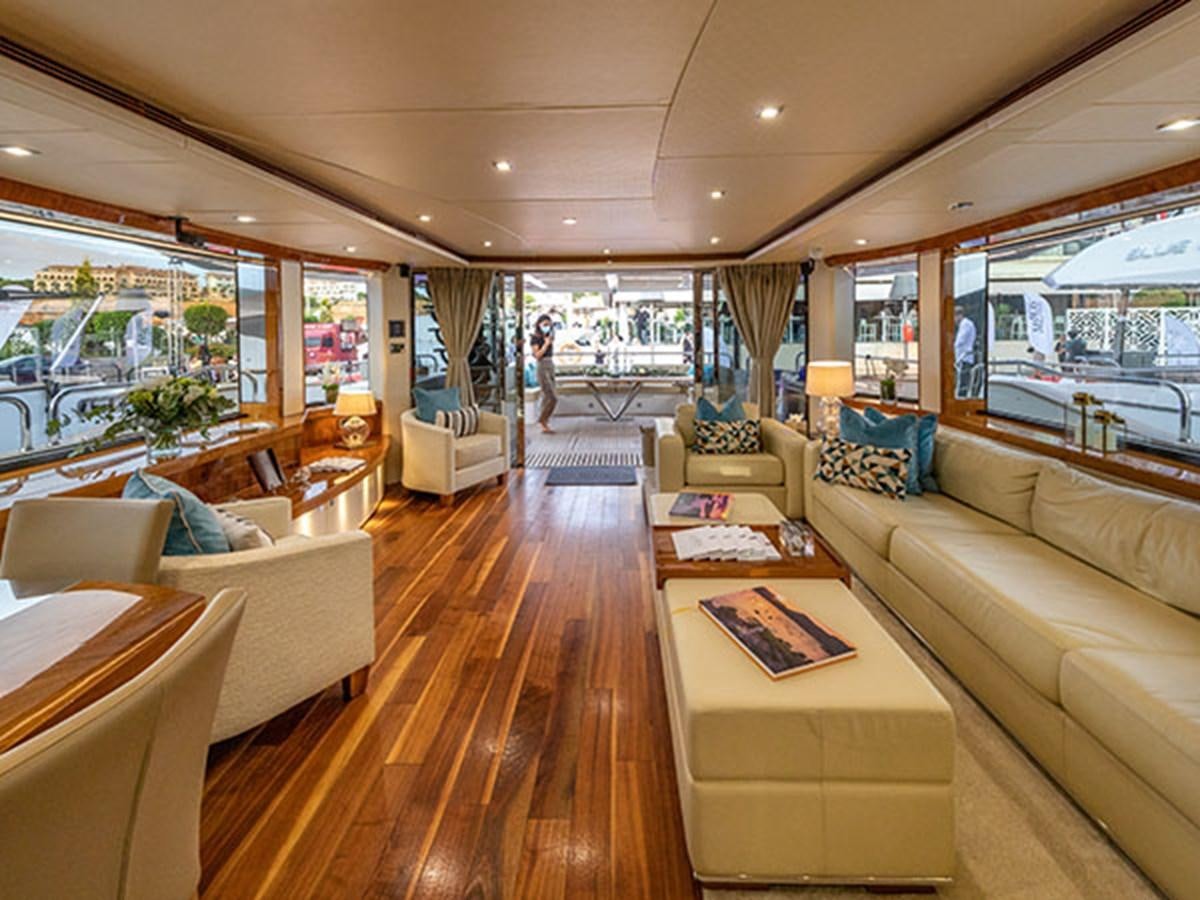 a living room with a large window aboard 28M Yacht for Sale