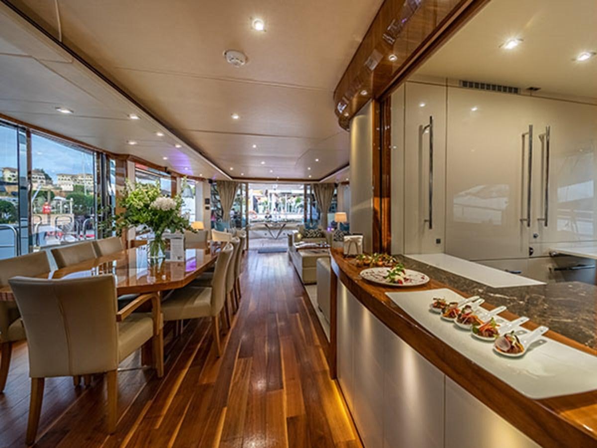 a kitchen with a large island aboard 28M Yacht for Sale