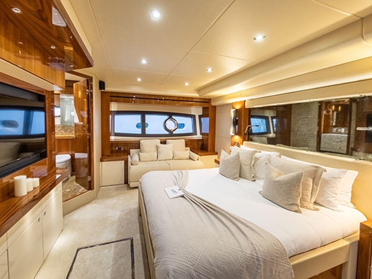 a room with a bed and a tv aboard 28M Yacht for Sale