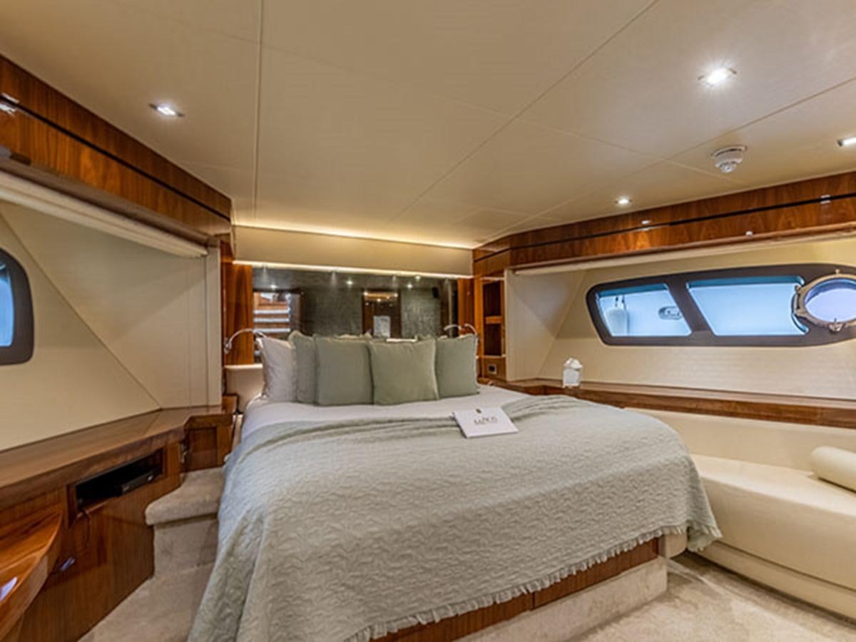 a room with a bed and a window aboard 28M Yacht for Sale
