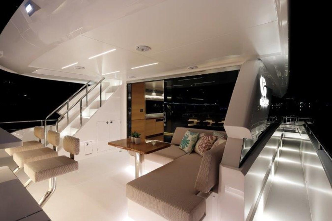 a living room with a couch and a coffee table aboard CROWNED EAGLE Yacht for Sale